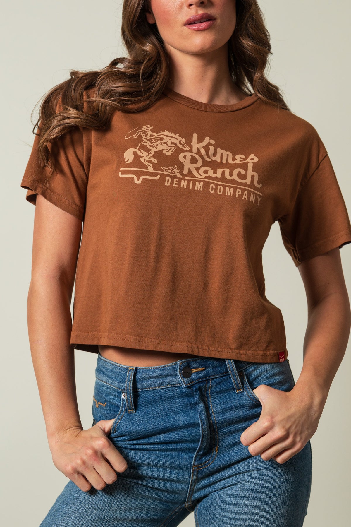 Kimes Ranch Davona Dale women's short sleeve crewneck tee in brown, printed with a Kimes Ranch logo graphic; #color_brown