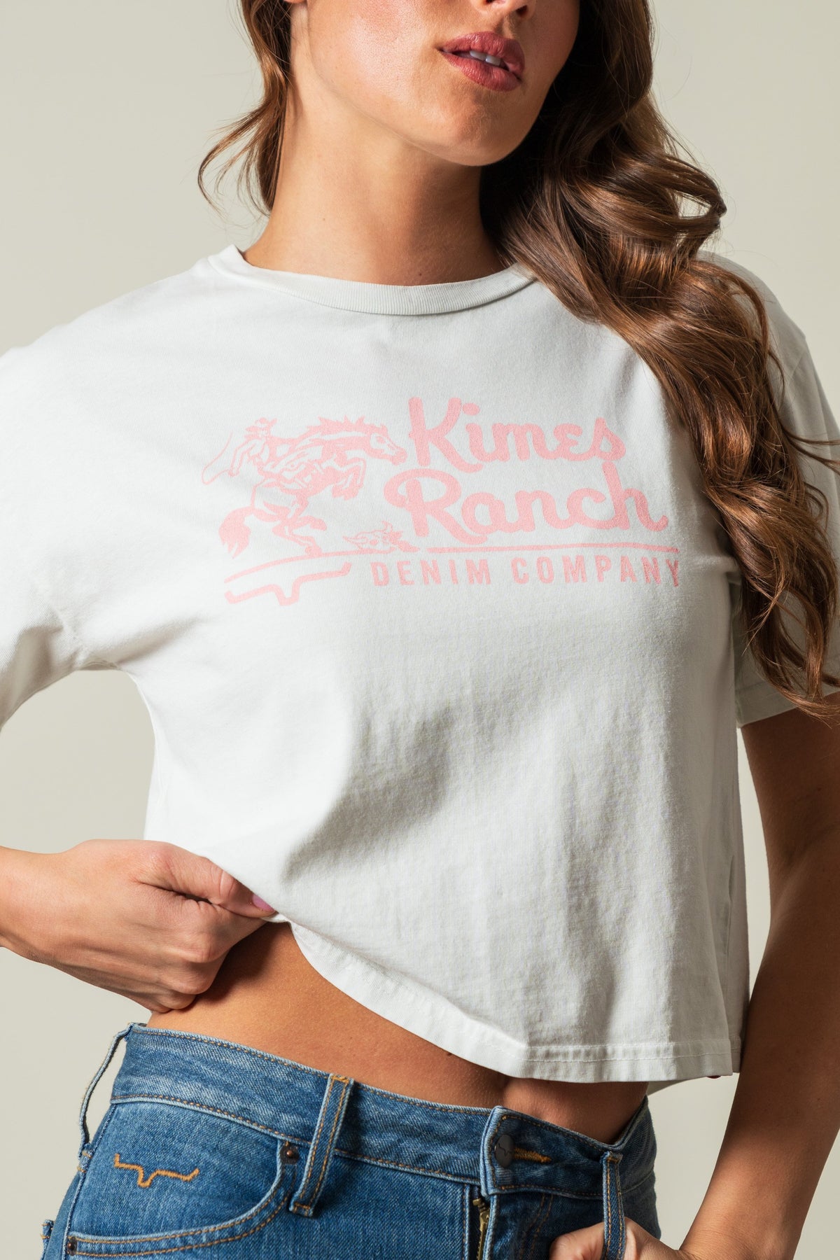 Kimes Ranch Davona Dale t-shirt in natural with pink graphic logo of horse rider, Kimes Ranch DENIM COMPANY; #color_natural