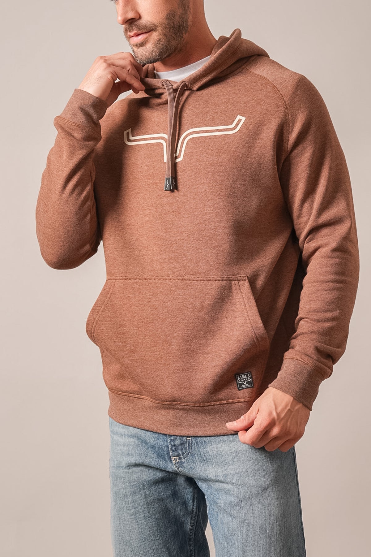 Kimes Ranch Outlier hoodie in dark brown heather with white graphic logo, front pouch pocket, and ribbed cuffs