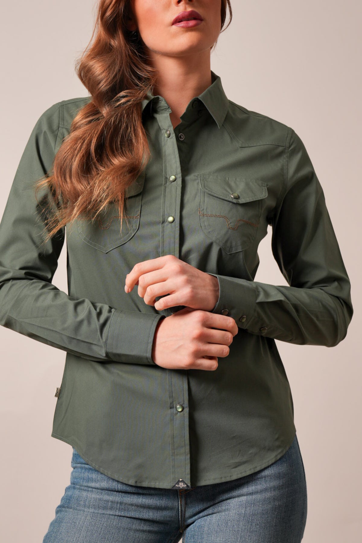 Kimes Ranch Skeeter long-sleeve top in dark olive with snap closures, yoke, and chest pockets