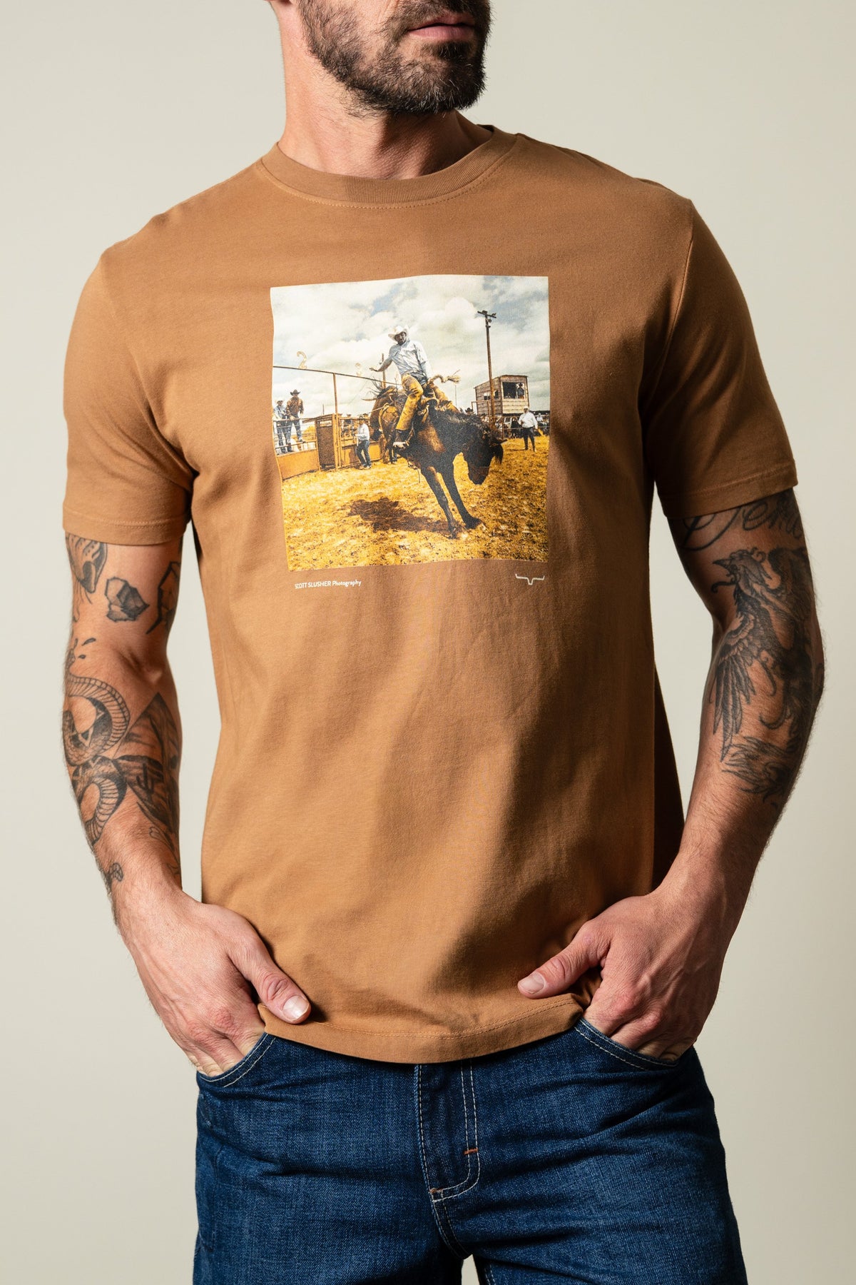 Kimes Ranch SS Classic Event shirt in Tobacco color with graphic of rodeo rider and "Scott Slusher Photography" text; #color_tobacco