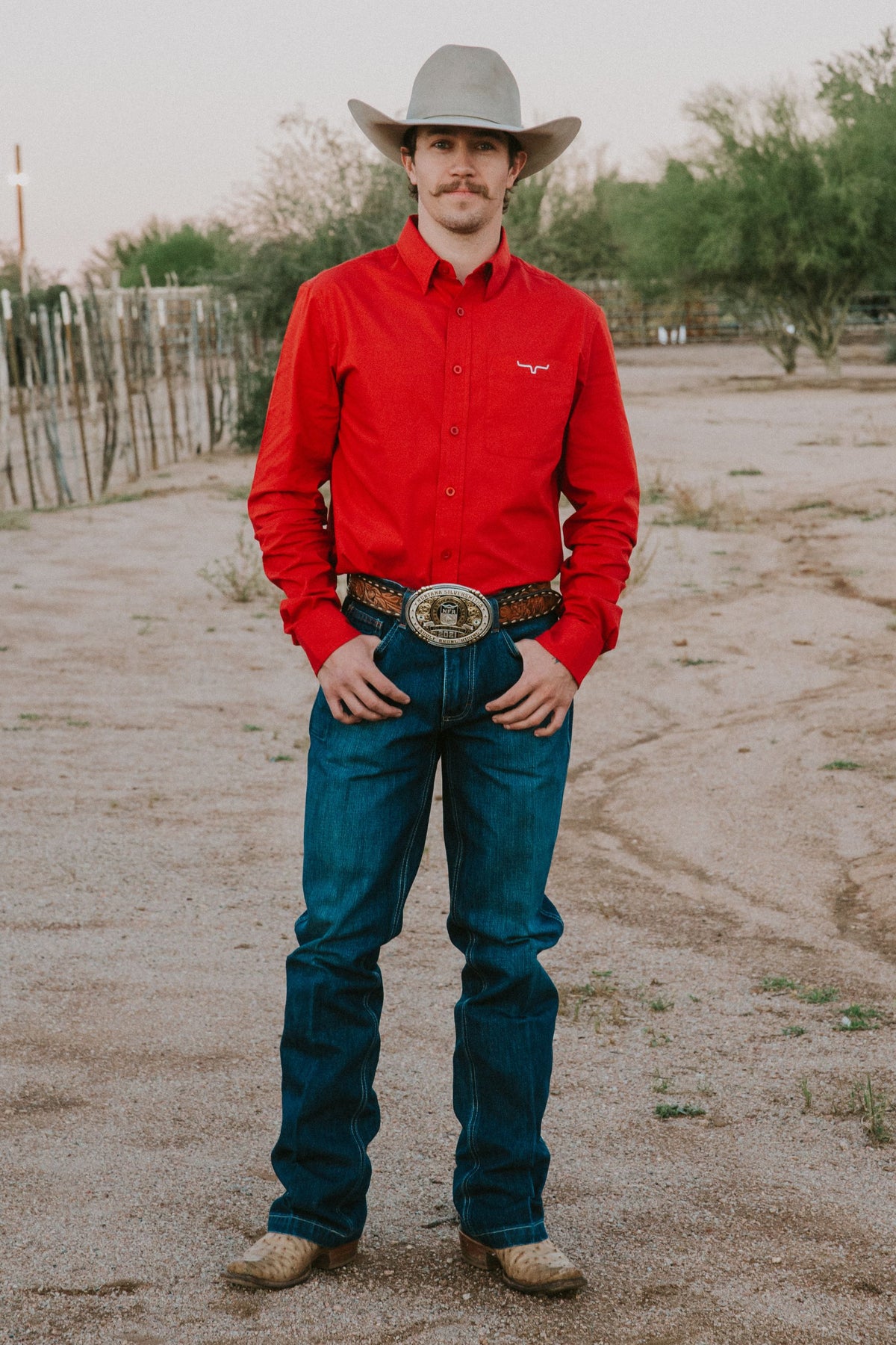 Kimes Ranch KR Team Dress Shirt in red with long sleeves, button front, chest pocket, and embroidered Kimes Ranch logo