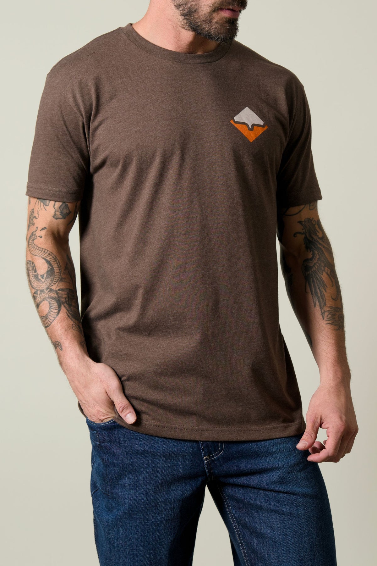 Kimes Ranch Warmth Shirt in brown with short sleeves and a chest logo
