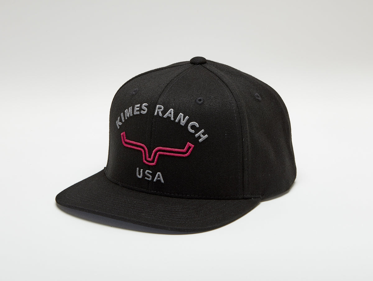Kimes Ranch Arched Trucker Hat in black with embroidered Kimes Ranch USA logo and red longhorn mark