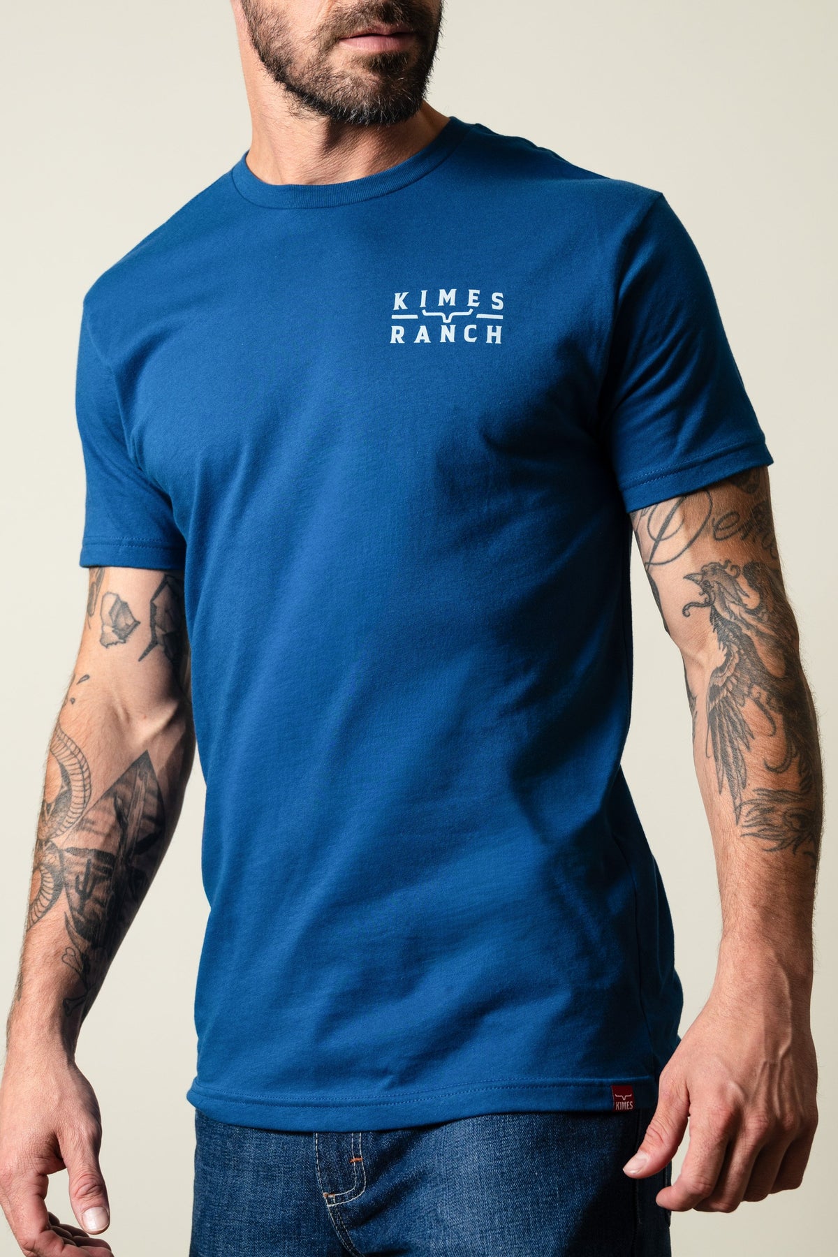 Kimes Ranch Back Branded shirt in Cool Blue, featuring the Kimes Ranch logo and white text on the chest; #color_cool blue