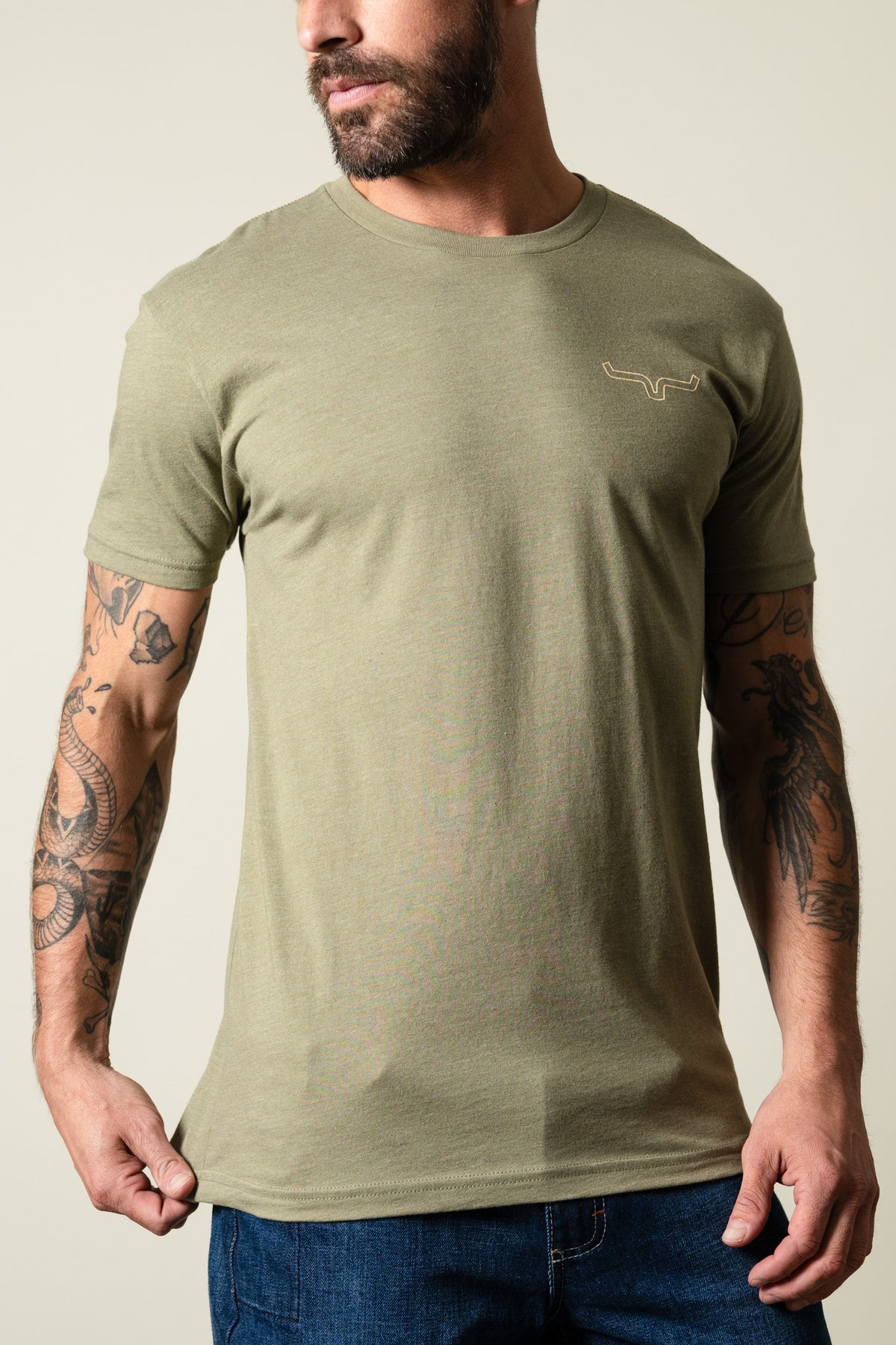 Kimes Ranch Camo Back t-shirt in light olive with short sleeves and a crewneck, featuring the Kimes Ranch logo on the chest; #color_light olive