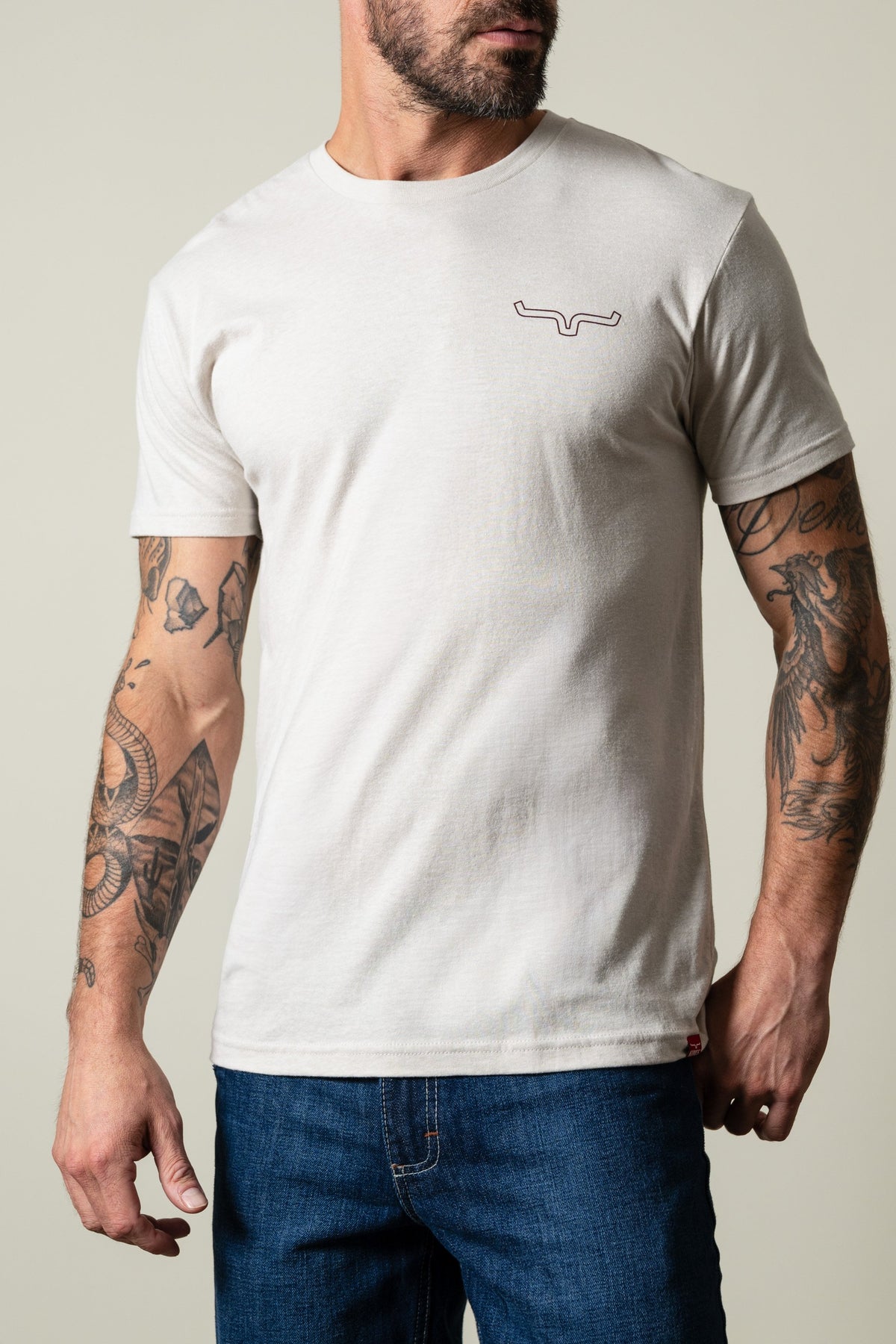 Kimes Ranch Camo Back shirt in Sand with short sleeves, crew neck, and Kimes Ranch logo on left chest; #color_sand