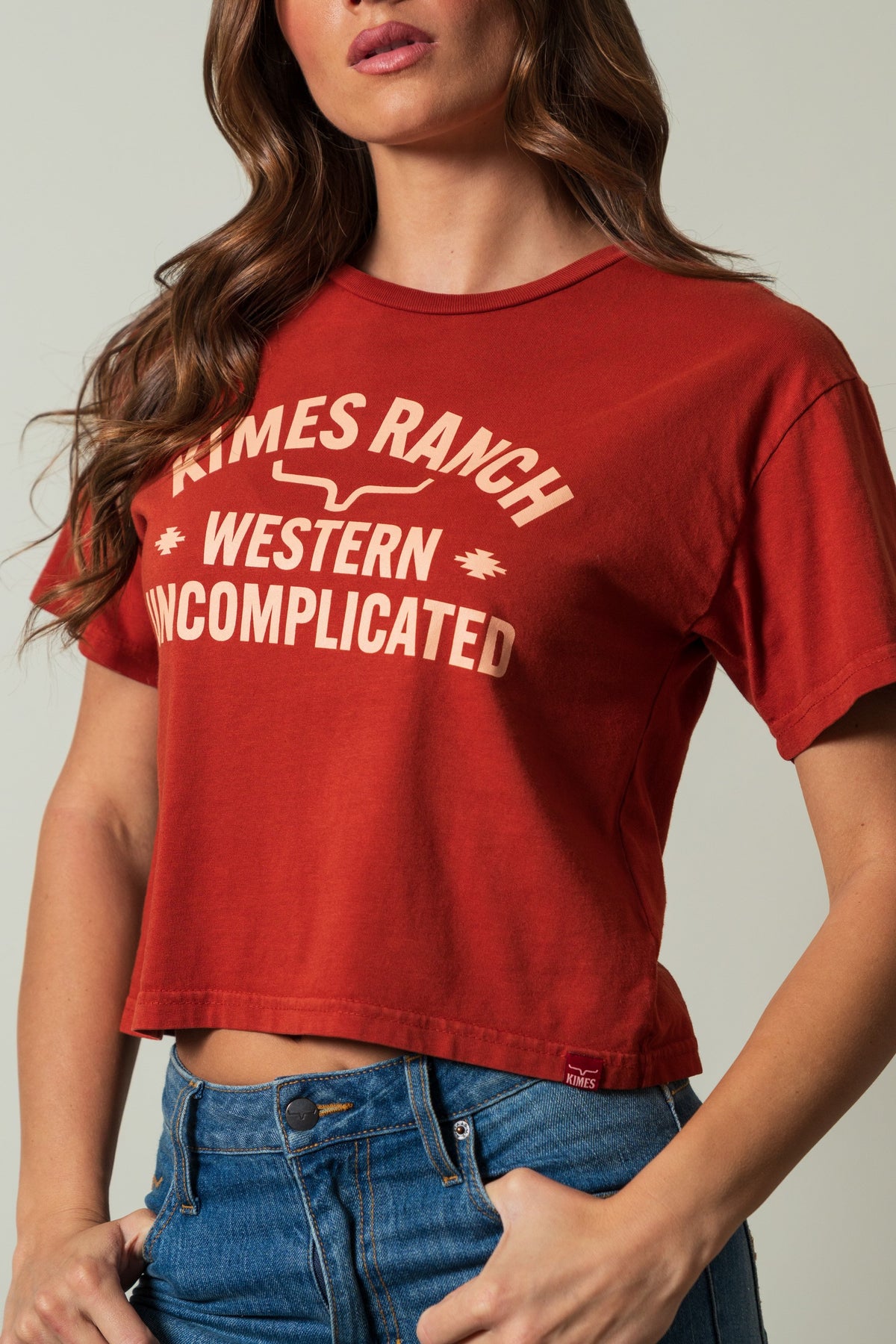Kimes Ranch Cavell shirt, burnt red, with 'KIMES RANCH WESTERN UNCOMPLICATED' graphic in a cream color; #color_burnt red