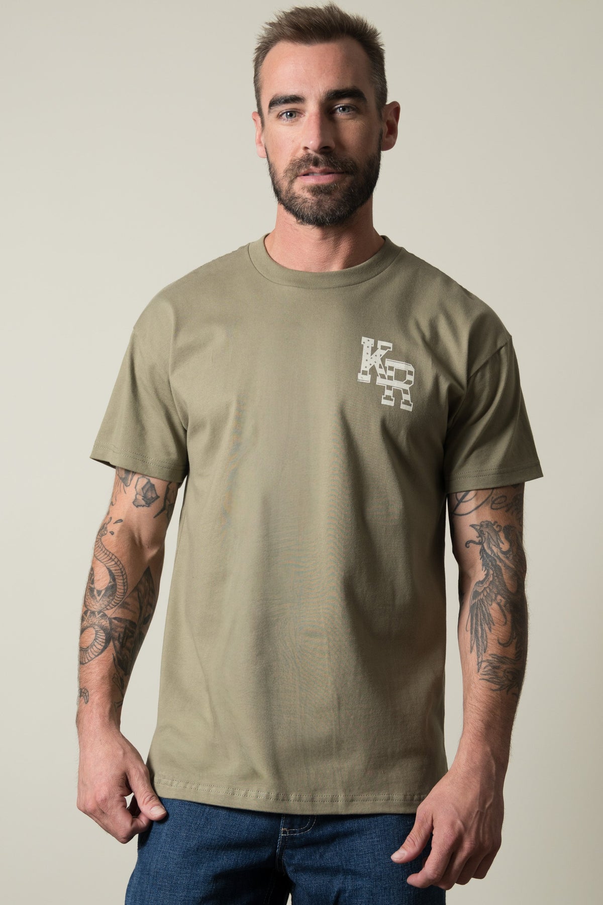 Kimes Ranch Red Glare shirt in Light olive, featuring a short-sleeve crewneck with a small Kimes Ranch logo on the front; #color_light olive