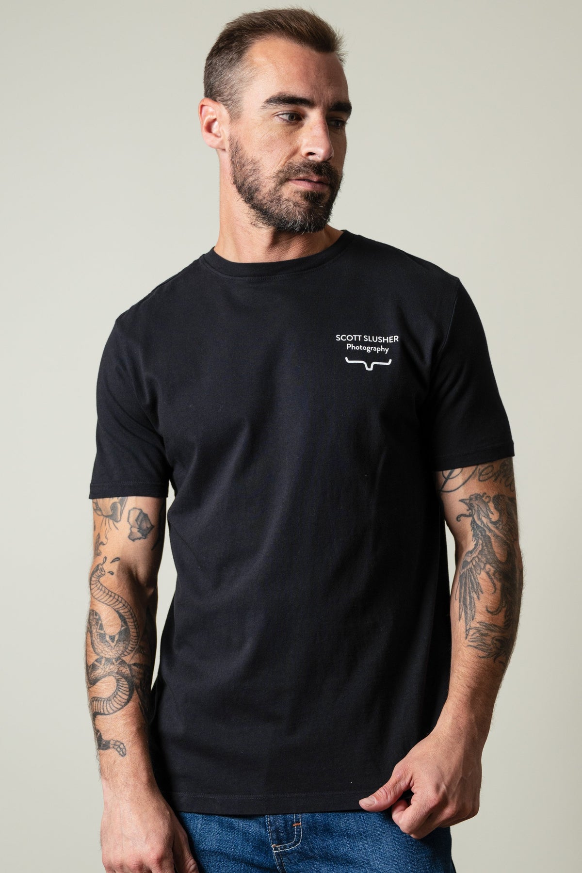 Kimes Ranch SS Bronc Ride black t-shirt with SCOTT SLUSHER Photography graphic and Kimes Ranch logo; #color_black