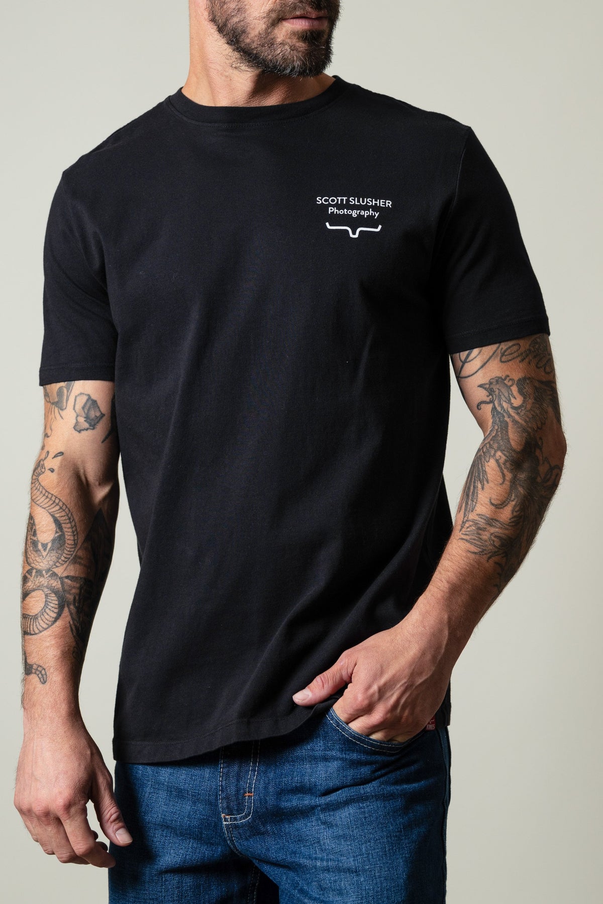 Kimes Ranch SS Bronc Ride Black t-shirt with white SCOTT SLUSHER Photography text and logo; #color_black