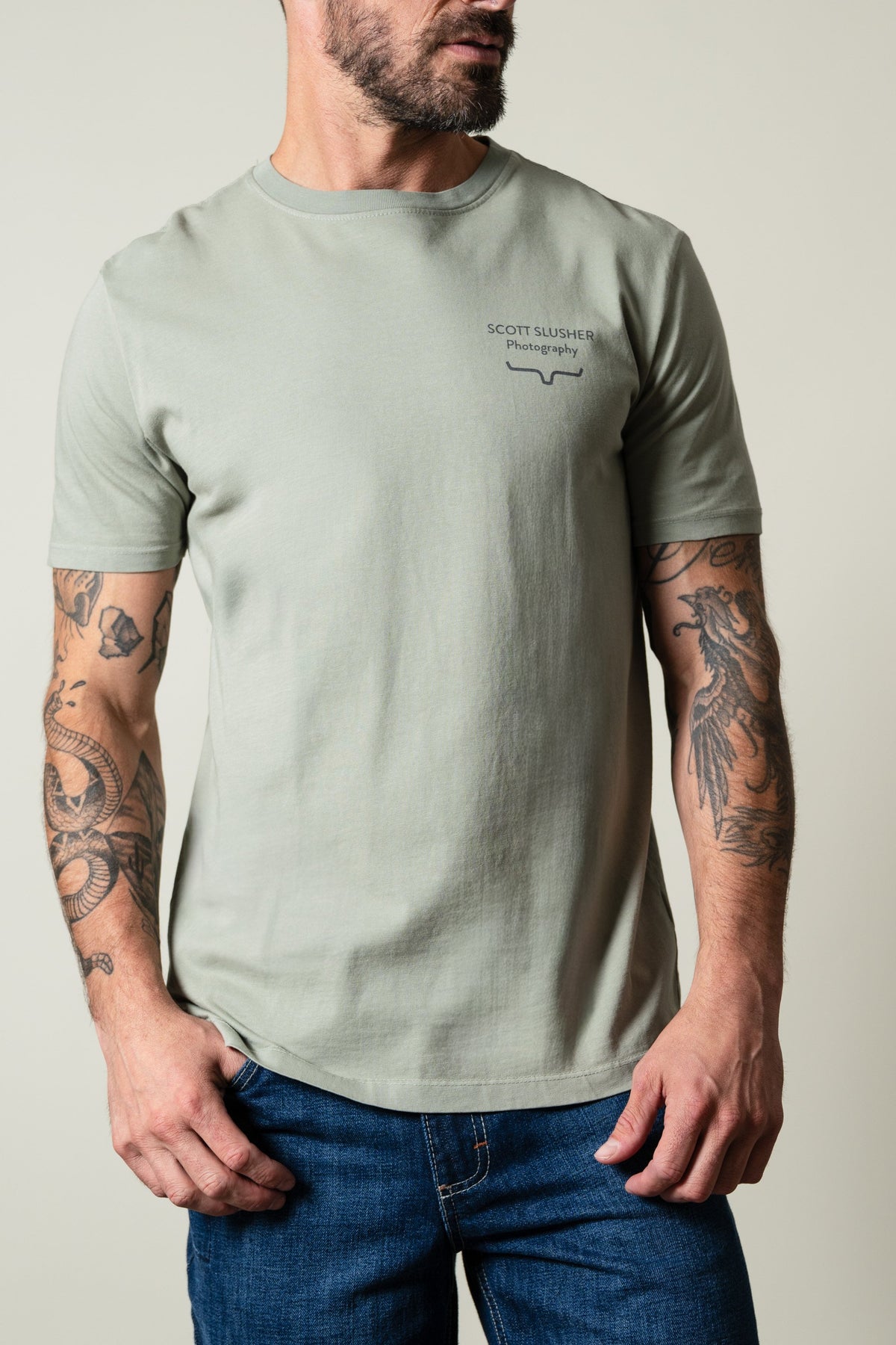 Kimes Ranch SS Bronc Ride Sage short sleeve t-shirt with SCOTT SLUSHER Photography text and logo chest graphic; #color_sage