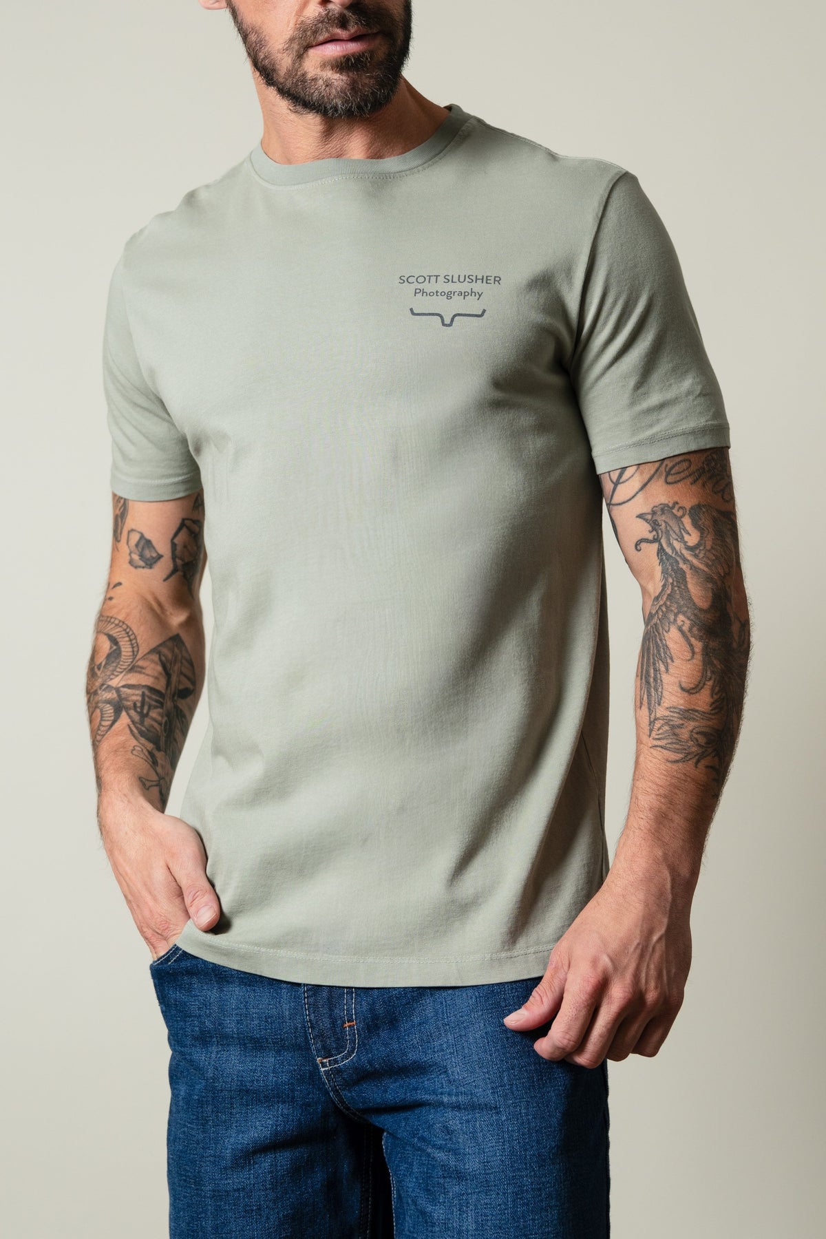 Kimes Ranch SS Bronc Ride Sage t-shirt with crew neck, short sleeves, and "SCOTT SLUSHER Photography" chest graphic; #color_sage