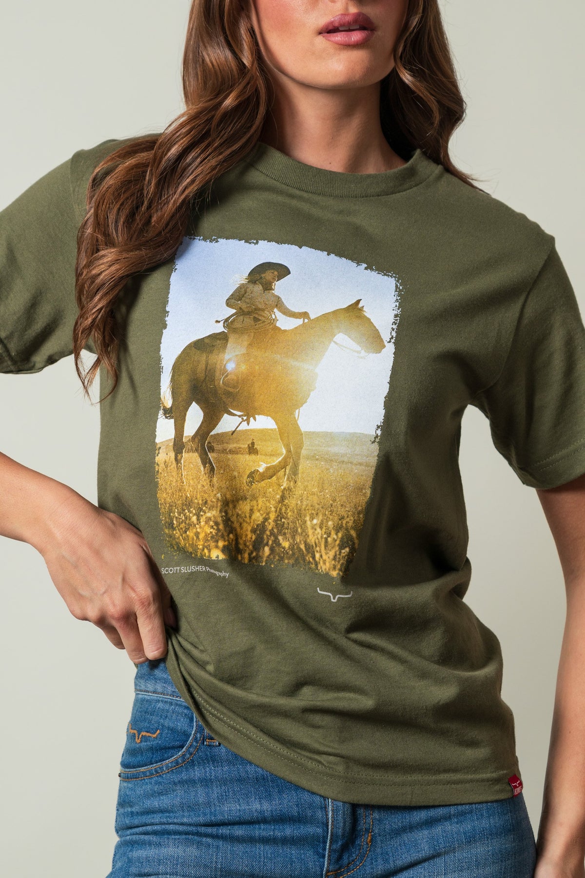 Kimes Ranch SS Riding Sunshine Military Green t-shirt with graphic of woman on horse, Scott Slusher Photography; #color_military green